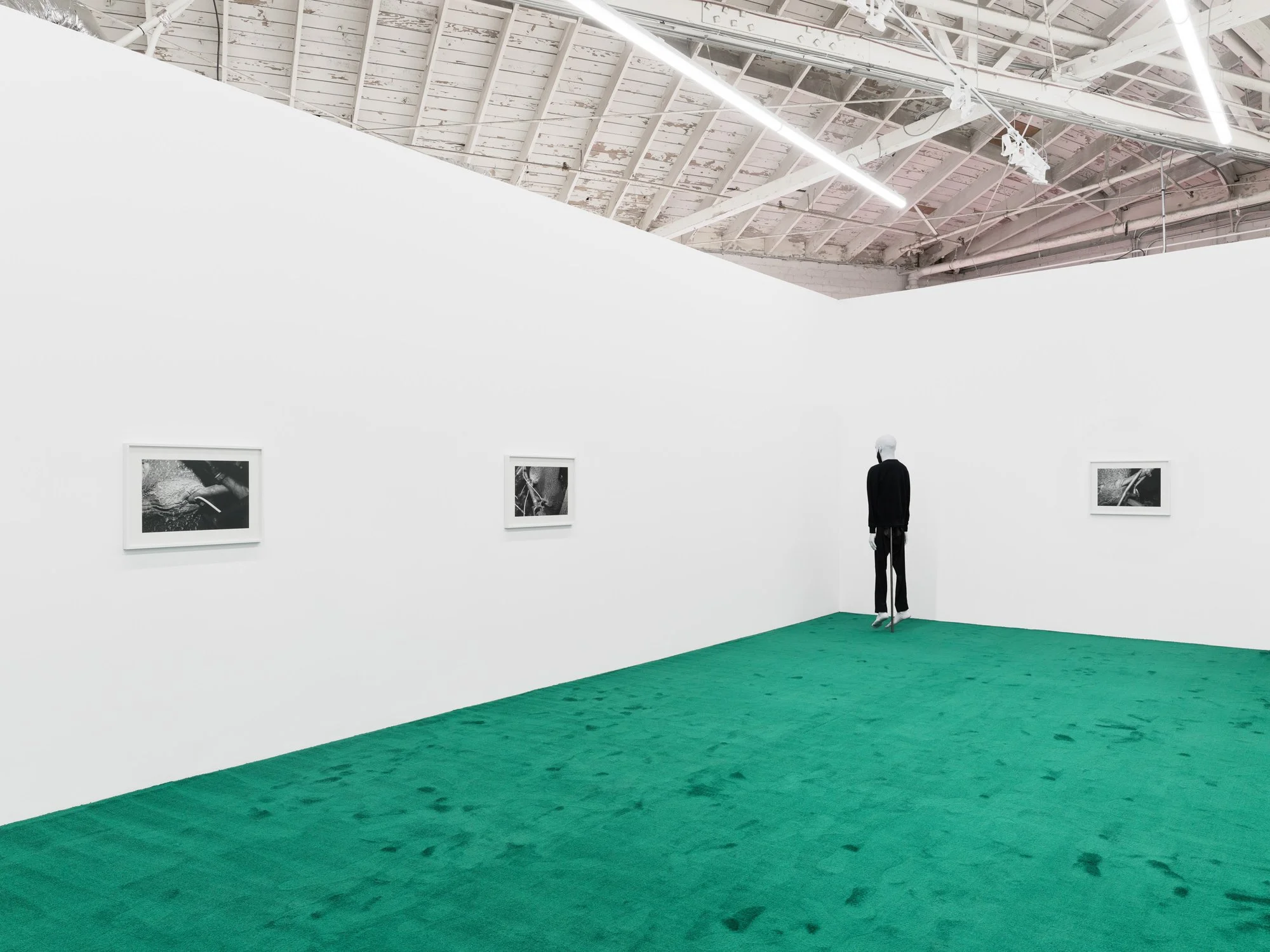   August 17, 2021  (2022) gelatin silver prints 20” x 27”   Christopher &nbsp;(2019) silicone, resin, hair, fabric 80” x 20” x 9”  Installation view of  One Eye Open  at Night Gallery, Los Angeles, USA 
