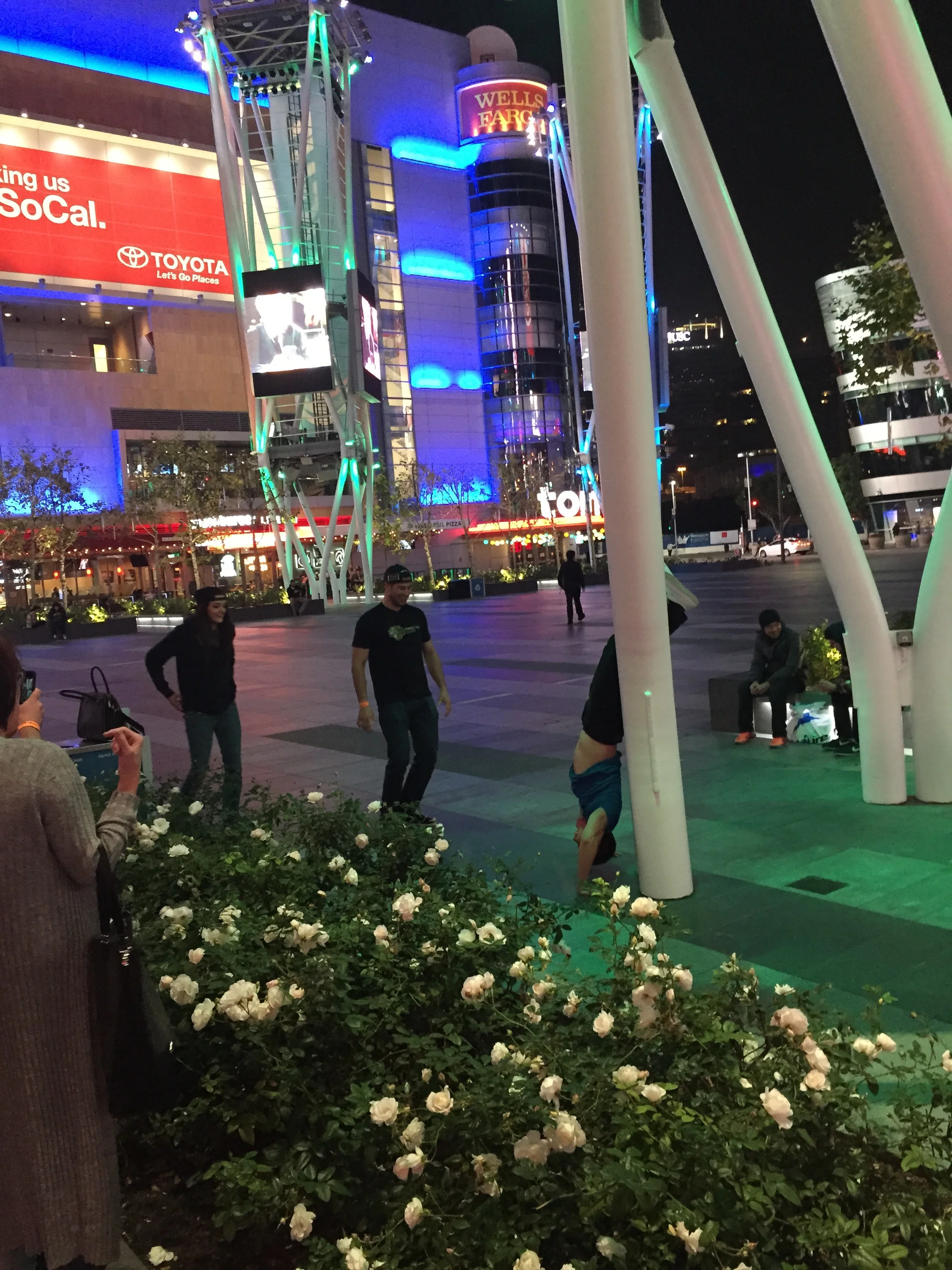 Condia doing handstands after winning $1 million. Of course he's showing his abs. 