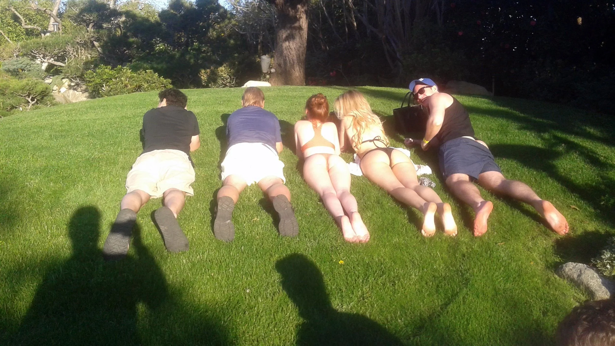 Lounging on the Playboy Mansion grass.