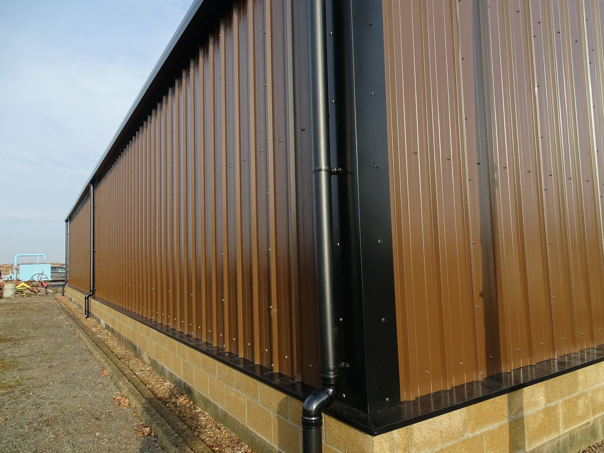 Tata Steel & Profiles vertical composite wall cladding, external streamline guttering and PVCu downpipe