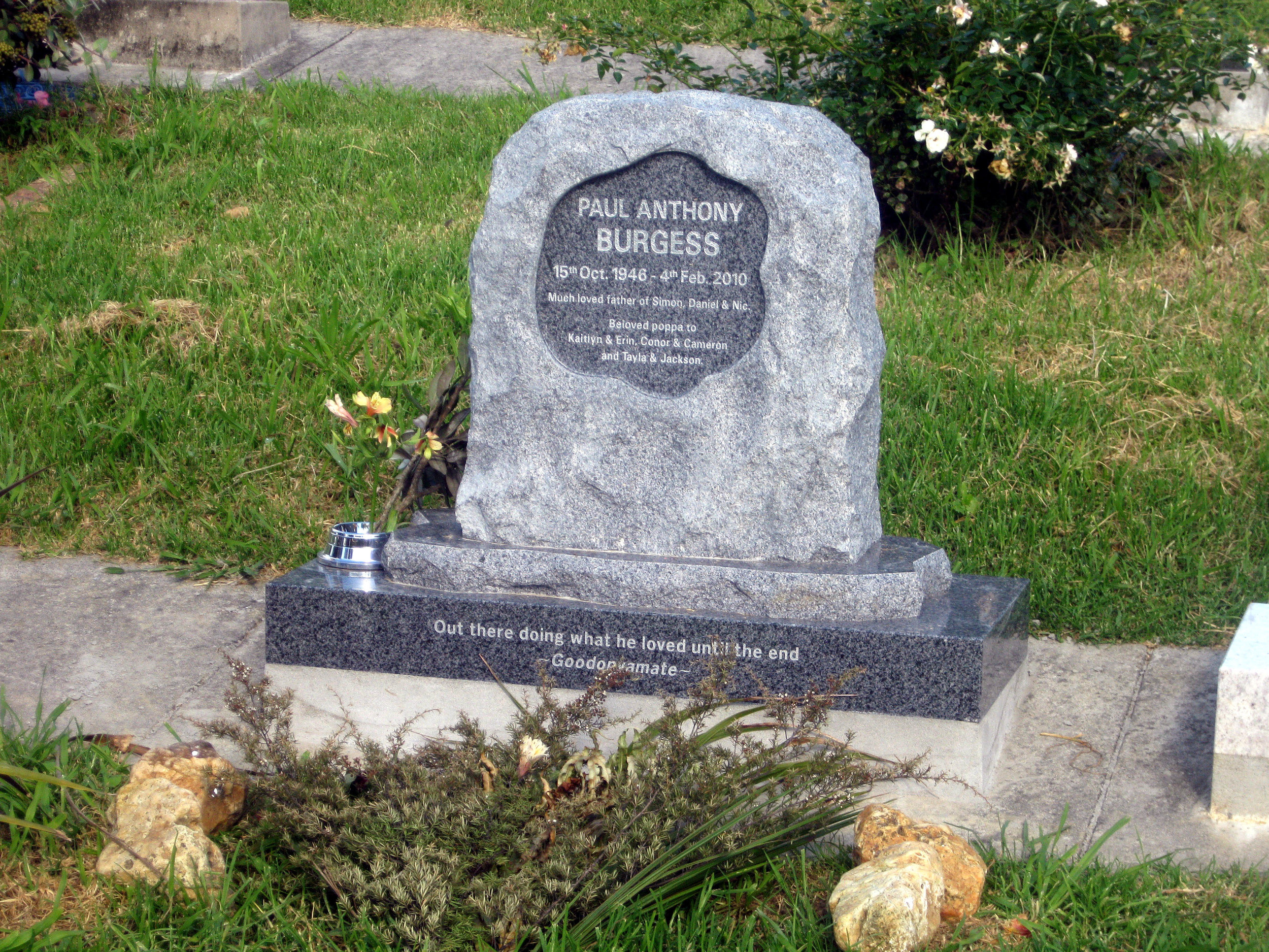 Grey granite custom designed headstone made from a boulder