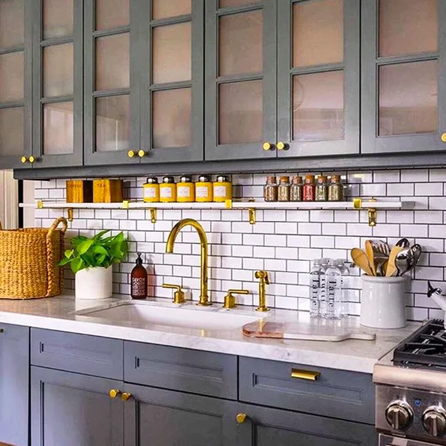 Henry (in unlacquered brass) ties it all together in a #Boston kitchen by@lizcaan. #WaterworksKitchen