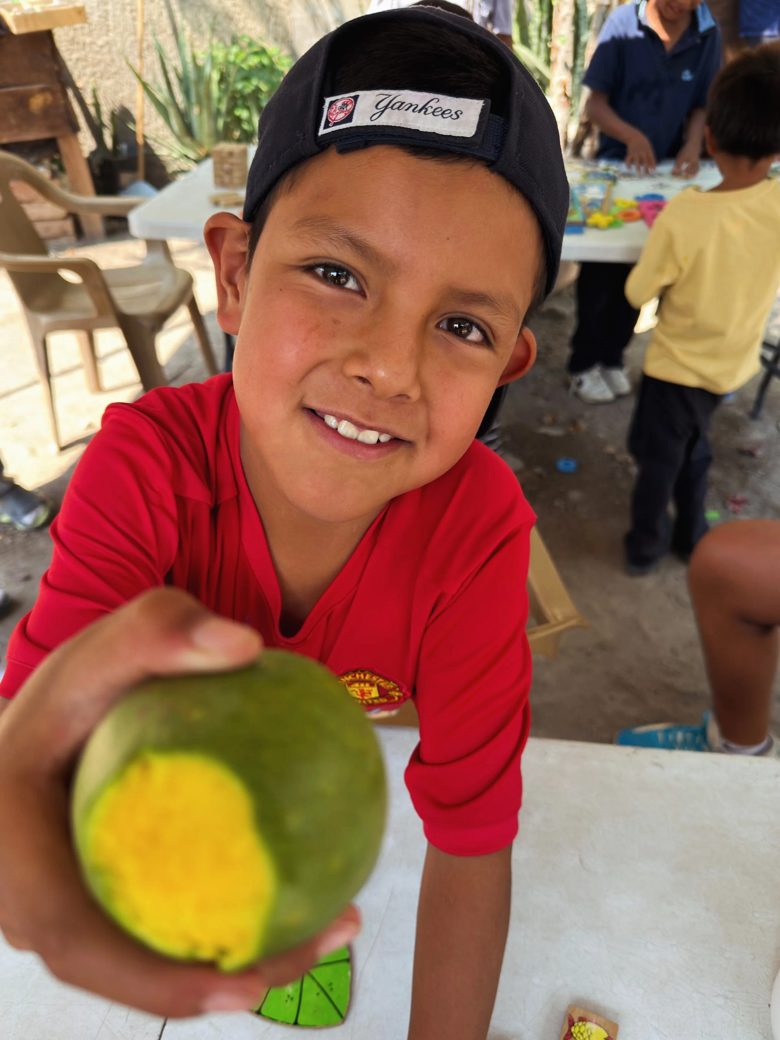 Seasonal fruit in our communities is seriously the best. 🥭✨ Mangoes, plums and so many others fill the streets this time of year. Every morning, many kids head out early to pick fruit before spending the day selling it in the streets to help support