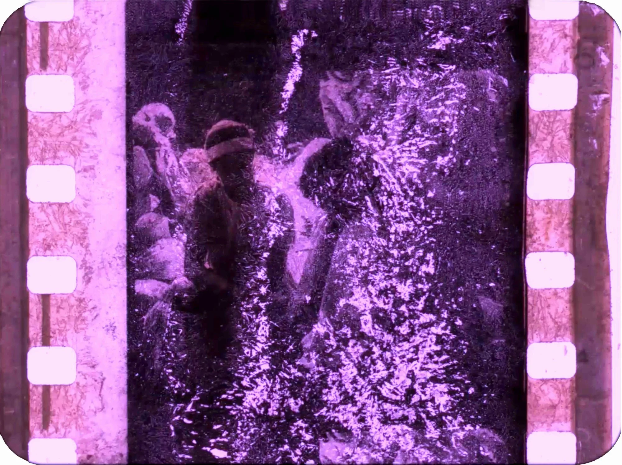 Zineb Sedira, Part of the installation Standing Here Wondering Which Way to Go (in four scenes), scene 1, mise-en-scène, video projection made out of decaying found footage rushes, 2019