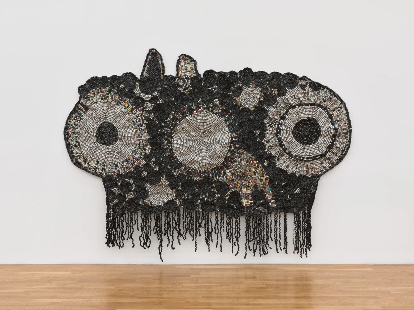 Moffat Takadiwa, Re-Reading Korekore, found computer plastic computer keys, Shona dictionary cuts and calculator plastic keys, 255 x 360 x 10 cm, 2022