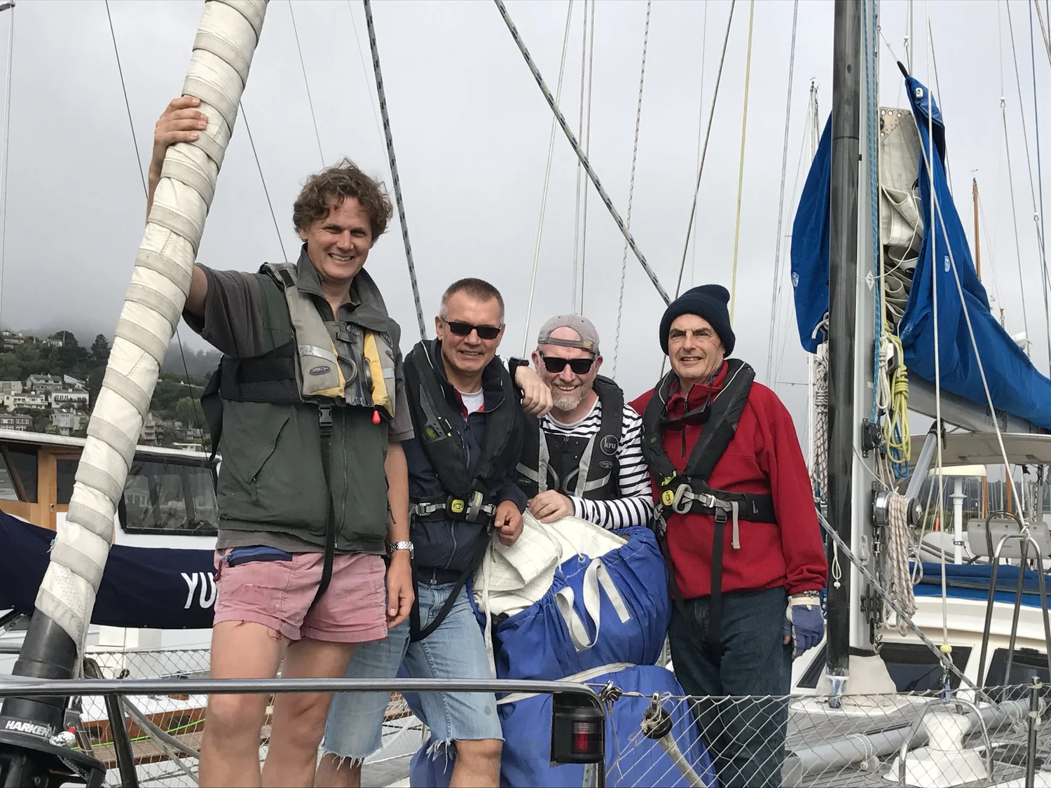 Crew working together at the helm of a yacht