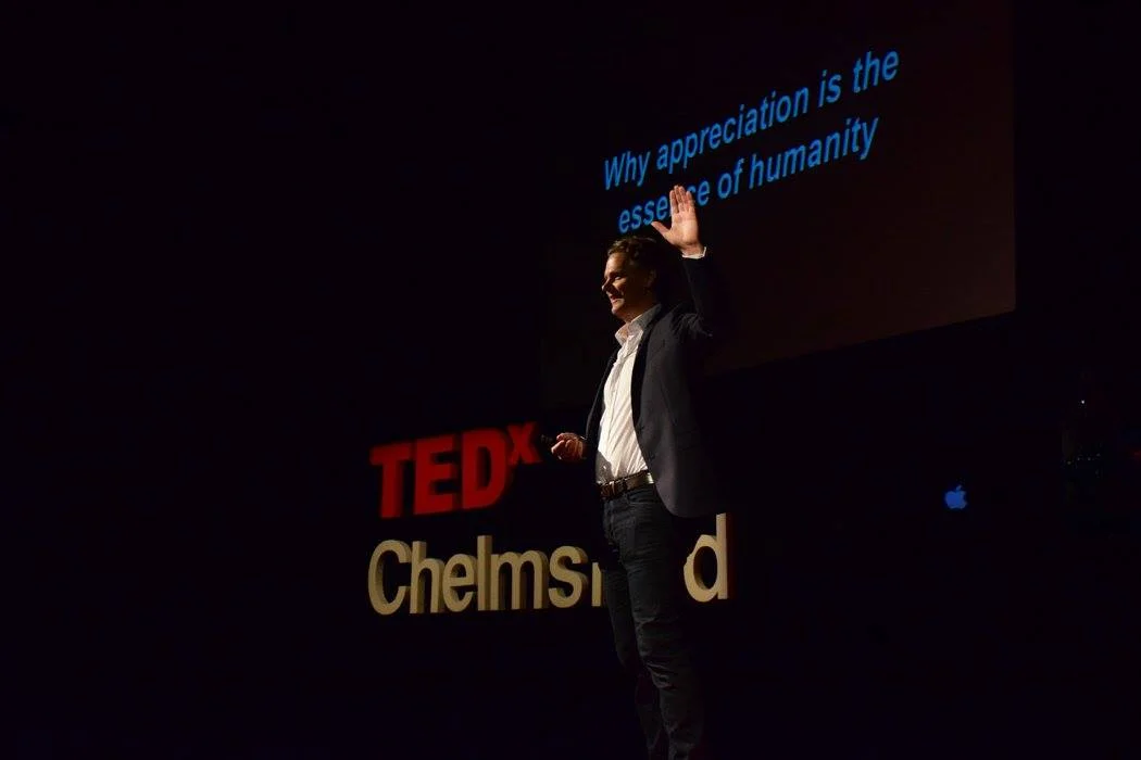 Caspar on TED Stage.jpg
