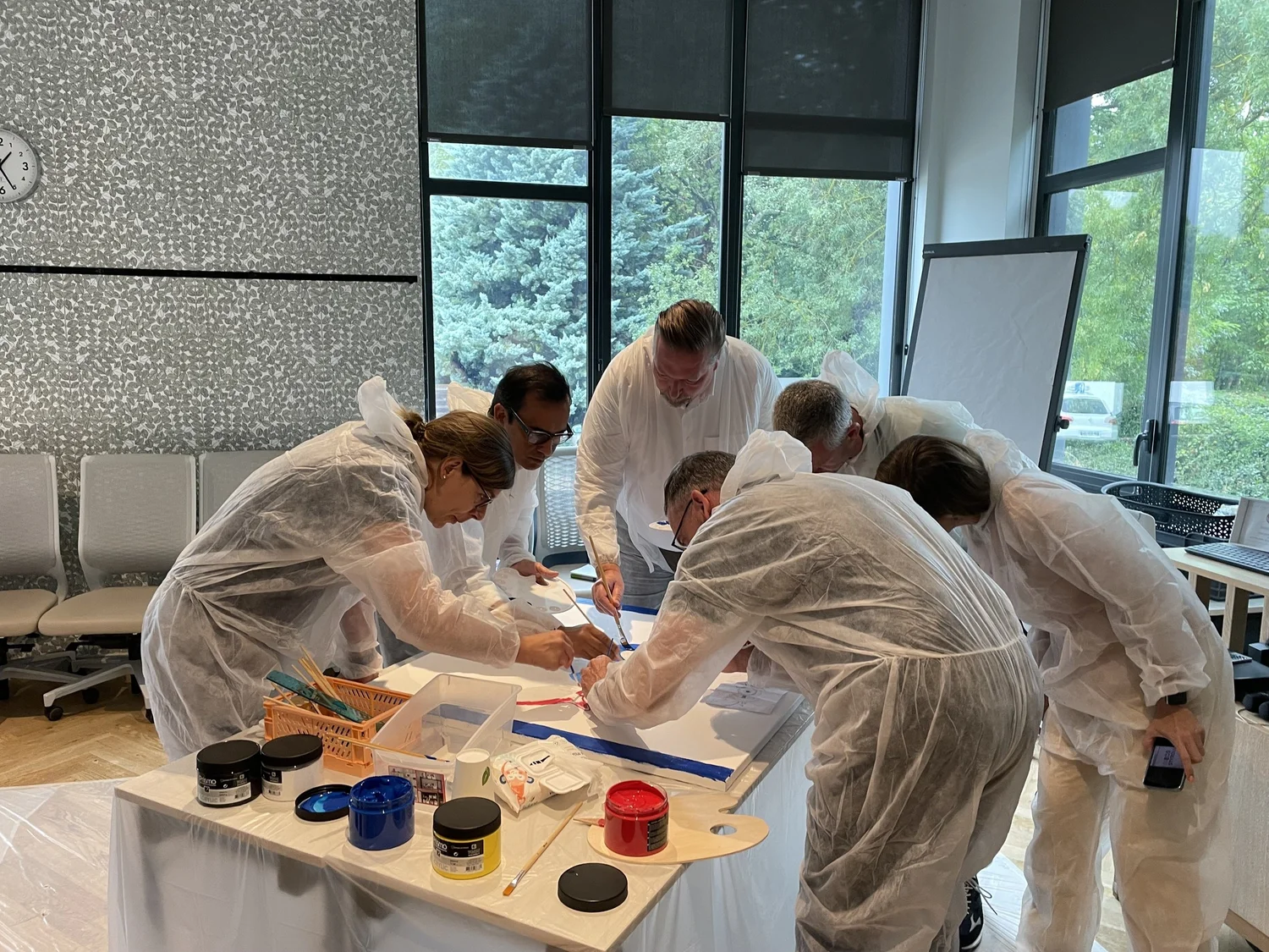 A team working together hands-on at a Big Bold Goals workshop