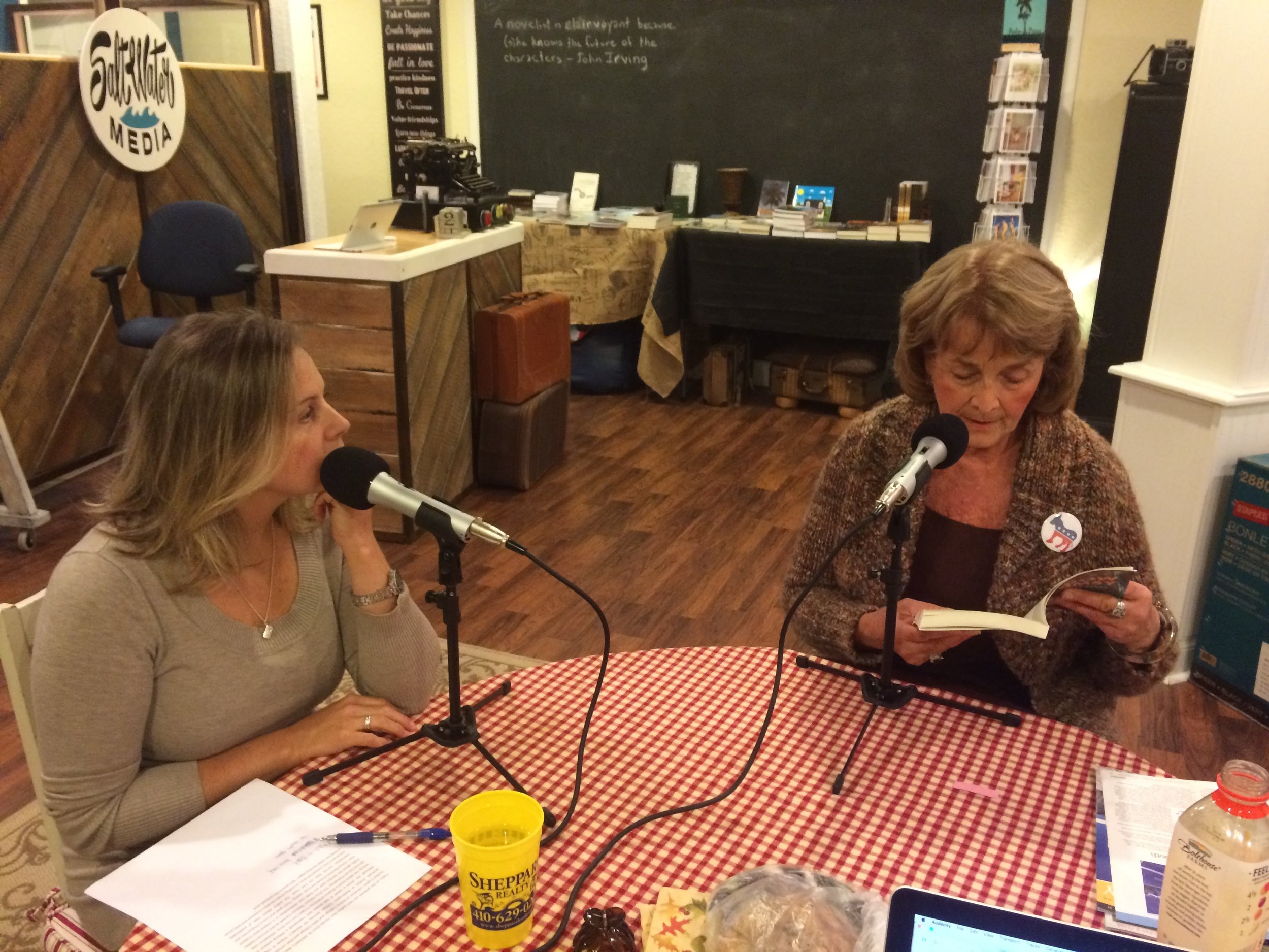 Stephanie listens as author Ann Hymes reads from her debut novel.