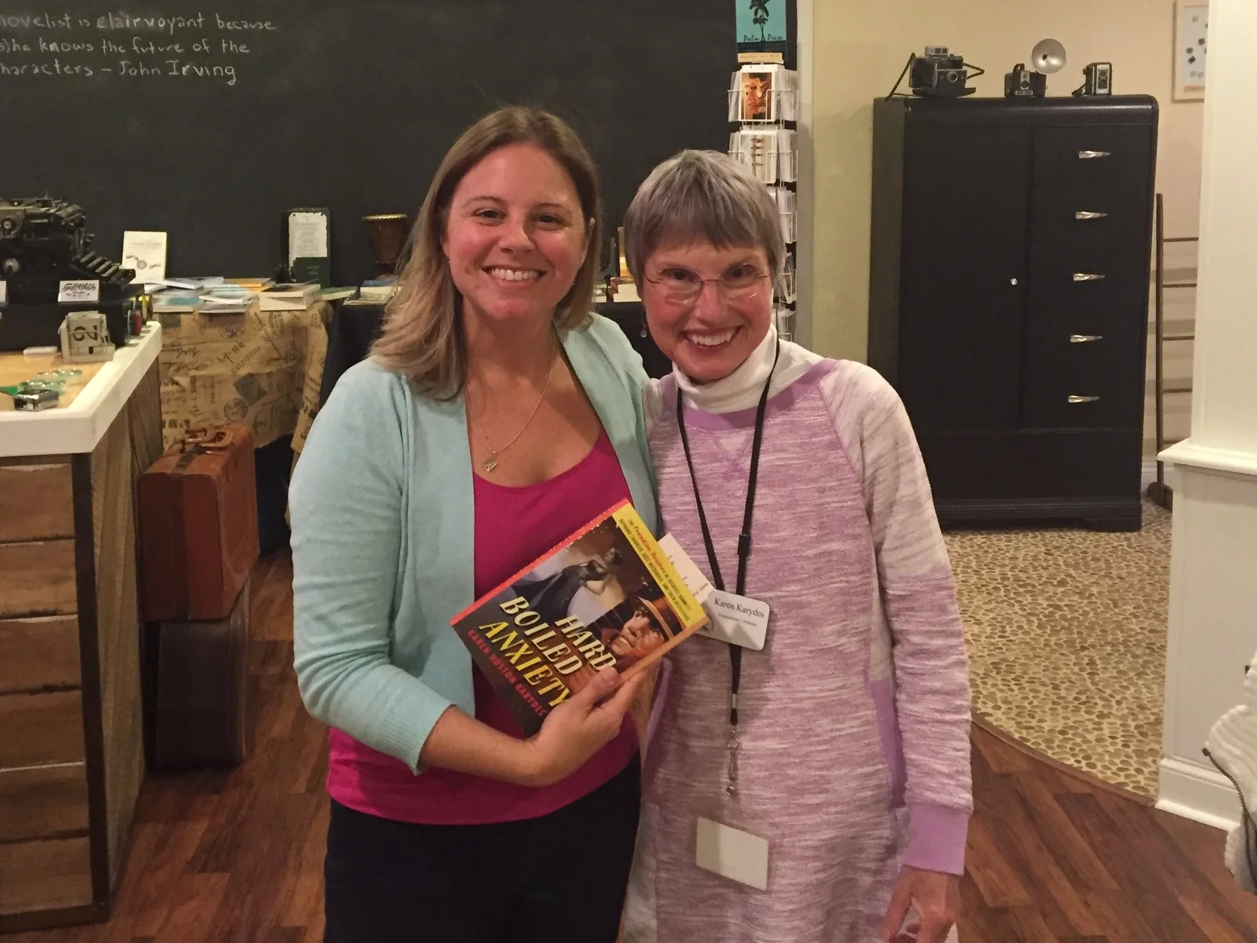 Stephanie poses with Karen Karydes and a copy of her new book, Hard Boiled Anxiety.