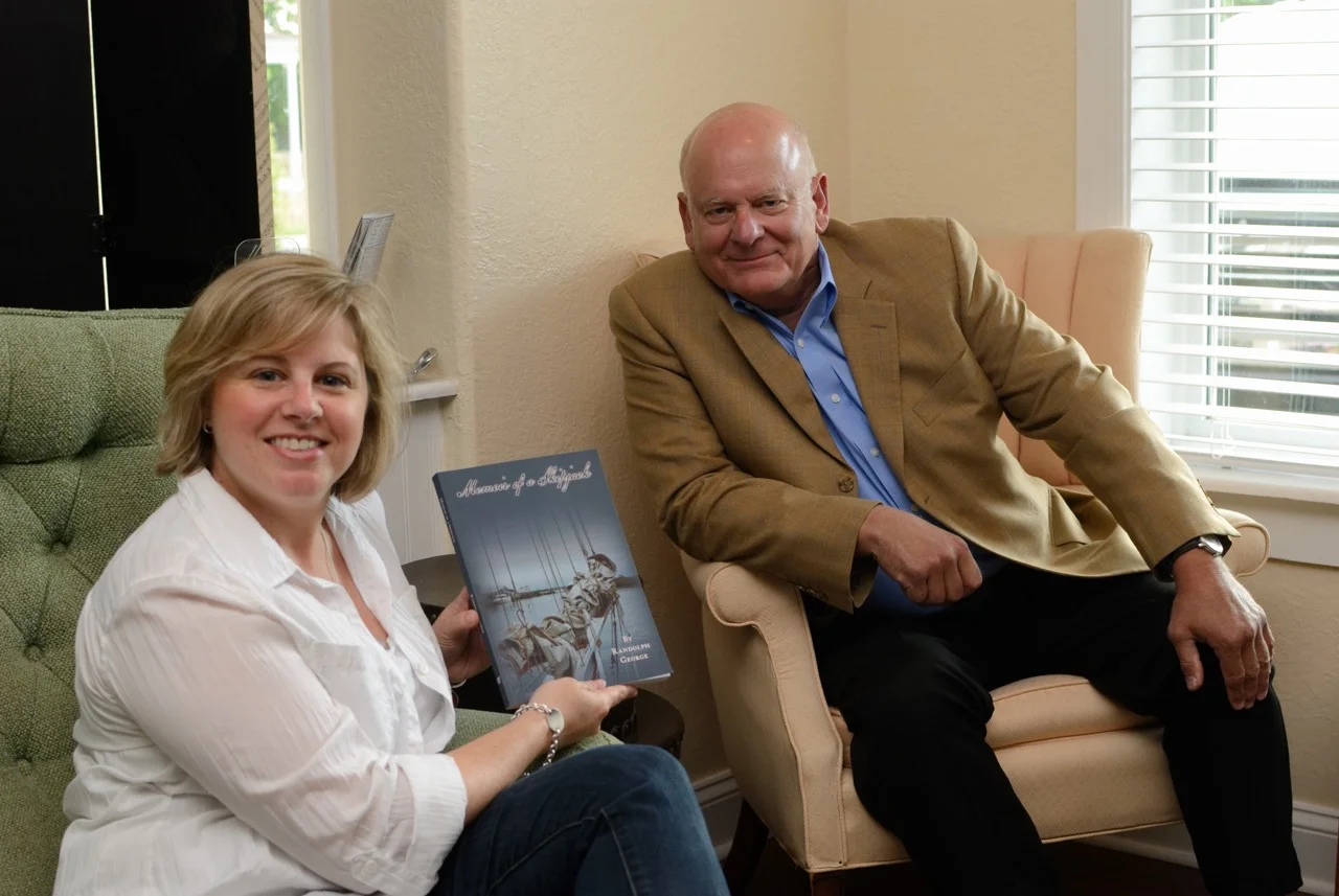 Stephanie holding "Memoir of a Skipjack" with its author, Randolph George