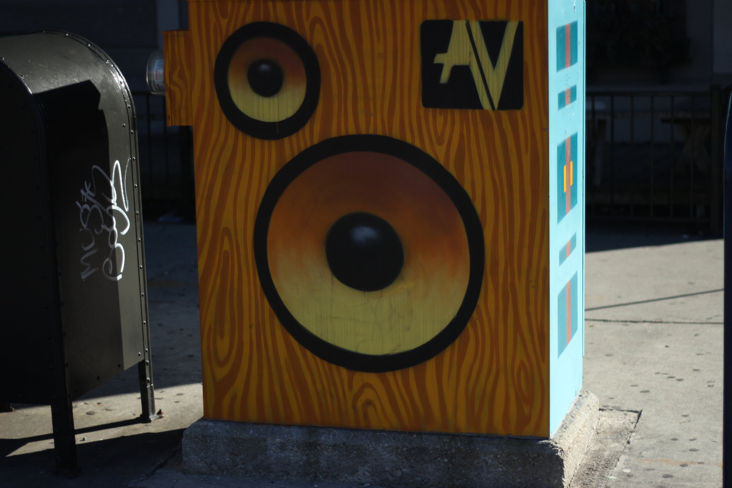 Most of the electrical boxes at intersections will have designs painted on them. (Artist Unknown.)