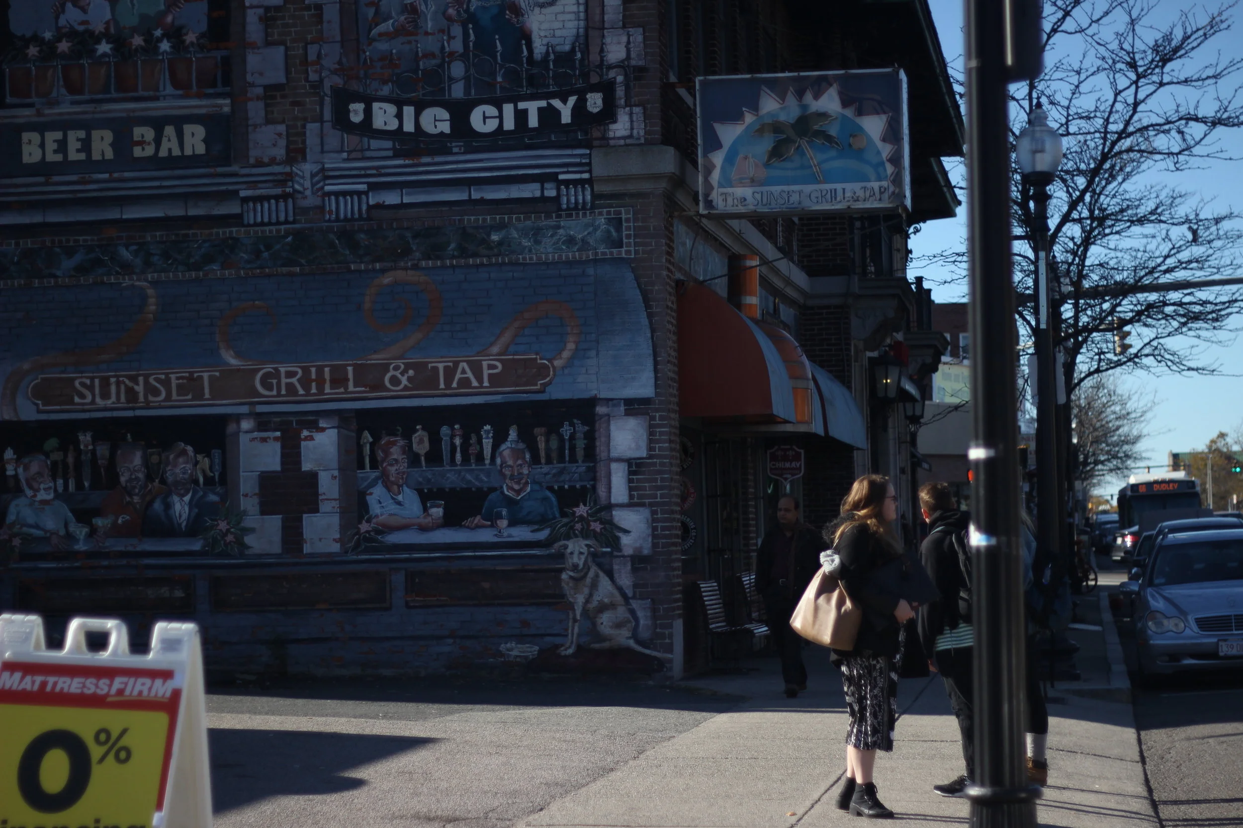 The Sunset Grill &amp; Tap's wall contains an enormous mural reminiscent of a more lively time in Allston. (Artist Unknown.)