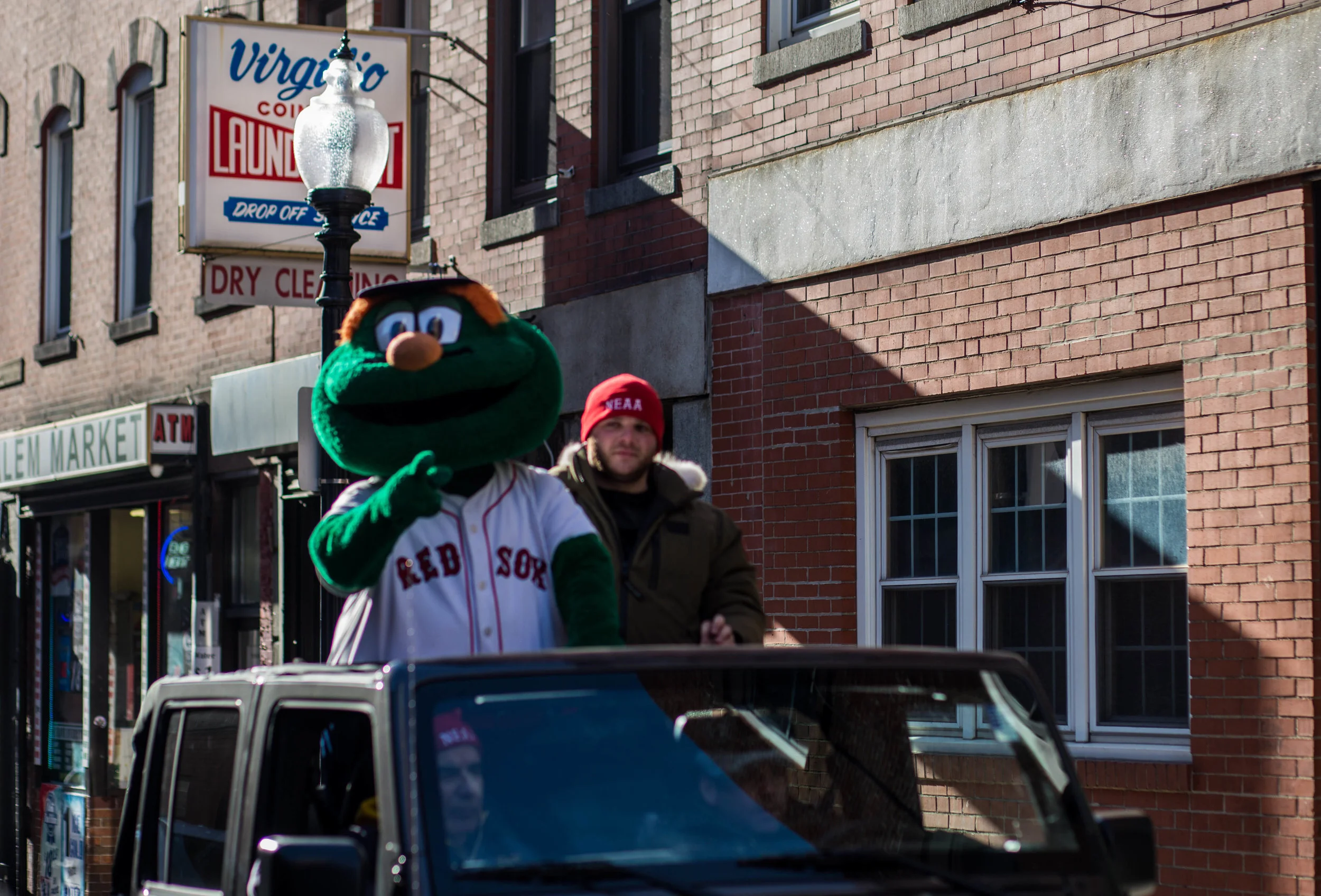  Wally the Green Monster enjoys the best seat in the house as he parades down the North End.    