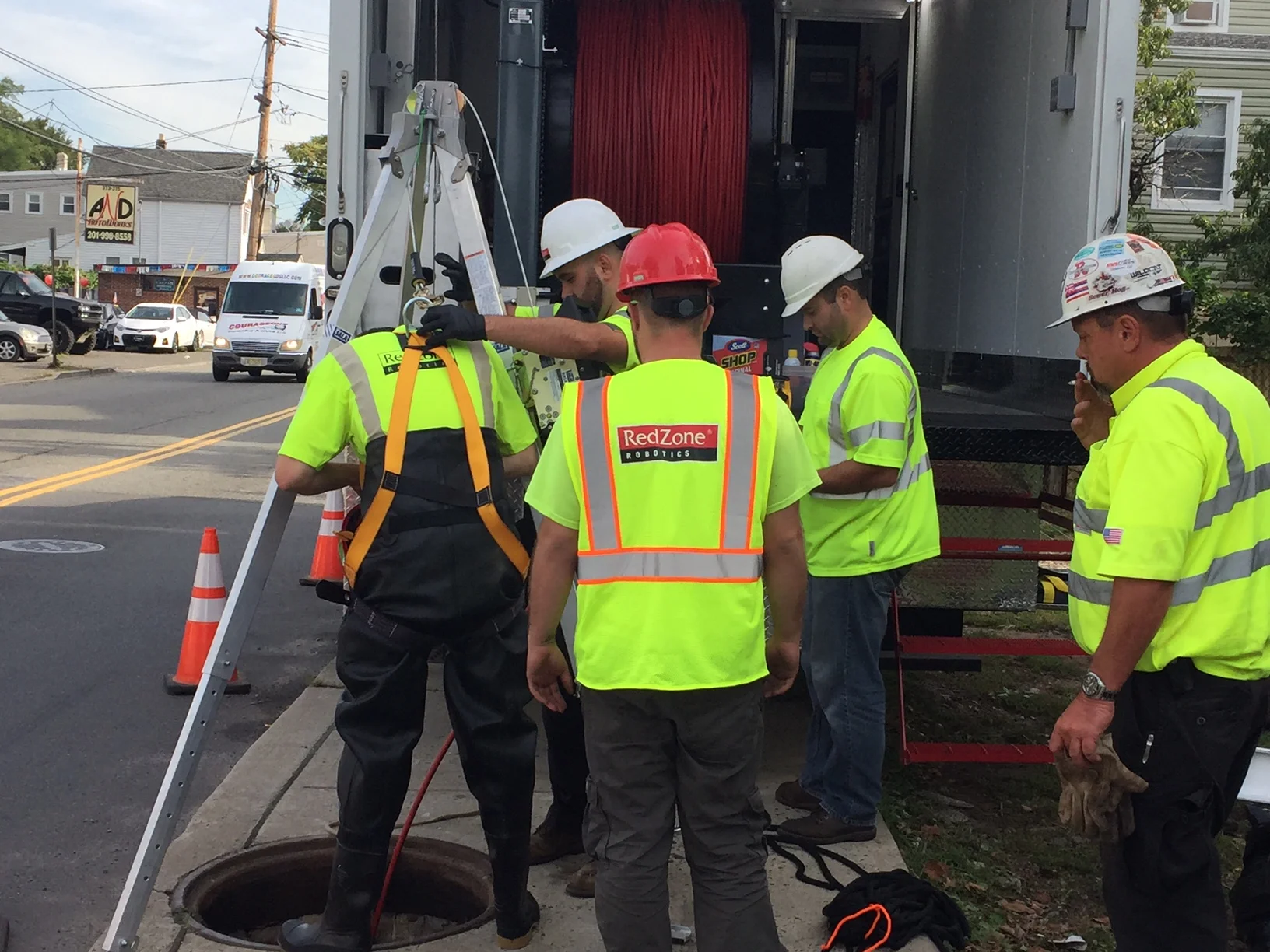 Entering the Manhole to Retrieve the Camera
