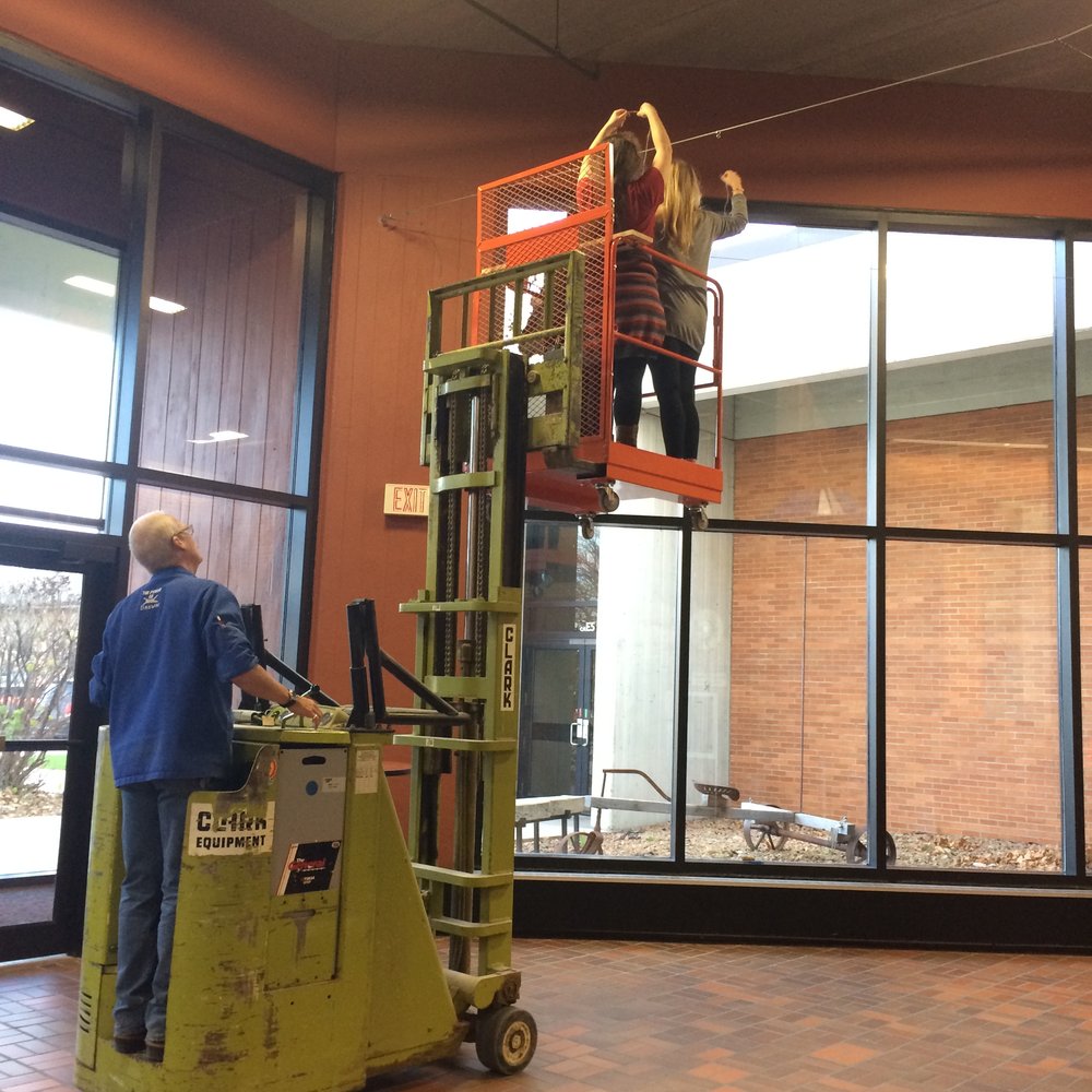 NOVEMBER 2016 Shop master Ken Brown gives Art 125 Foundation Design students a lift to install their latest group project. 