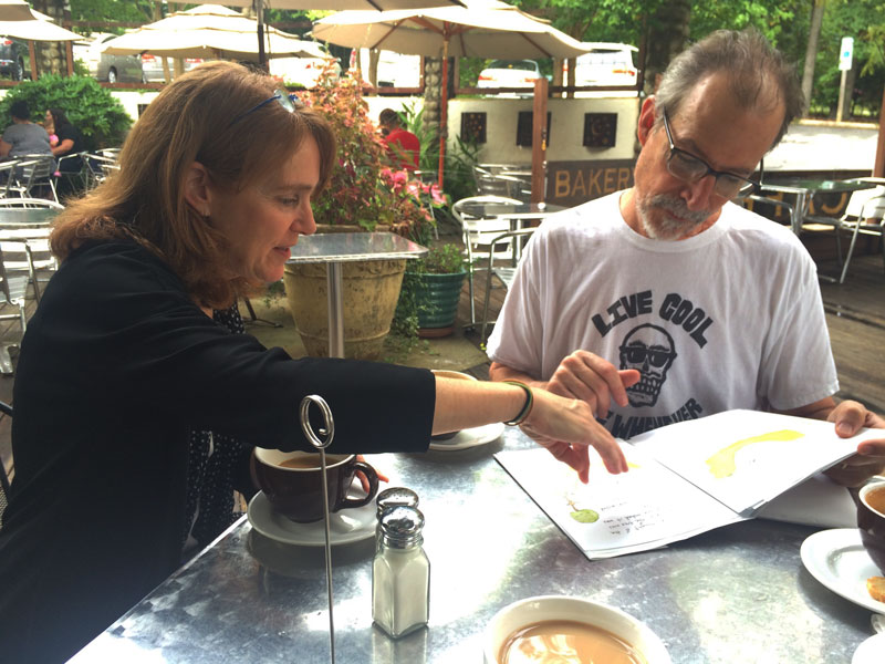 Ginger and Daniel review an early proof of the book.