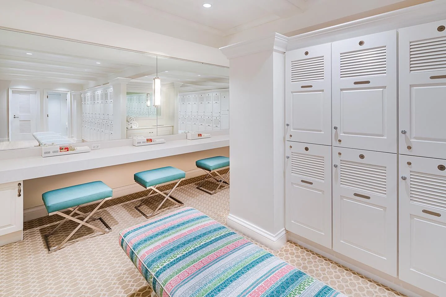 In contrast to the darker men&rsquo;s locker room in yesterday&rsquo;s post, the women&rsquo;s locker room is bright and serene, with pops of color to add variety to the light woods. // #architecture #design #lockerroom #hospitality #club #interiorde