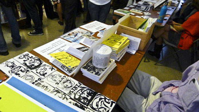 The blue variant of the "Hi, I'm Daniel" poster can be seen in the lower right. This photo is from the 1st LA Zine Fest in 2012, which took place upstairs at the Last Bookstore in Los Angeles, CA.