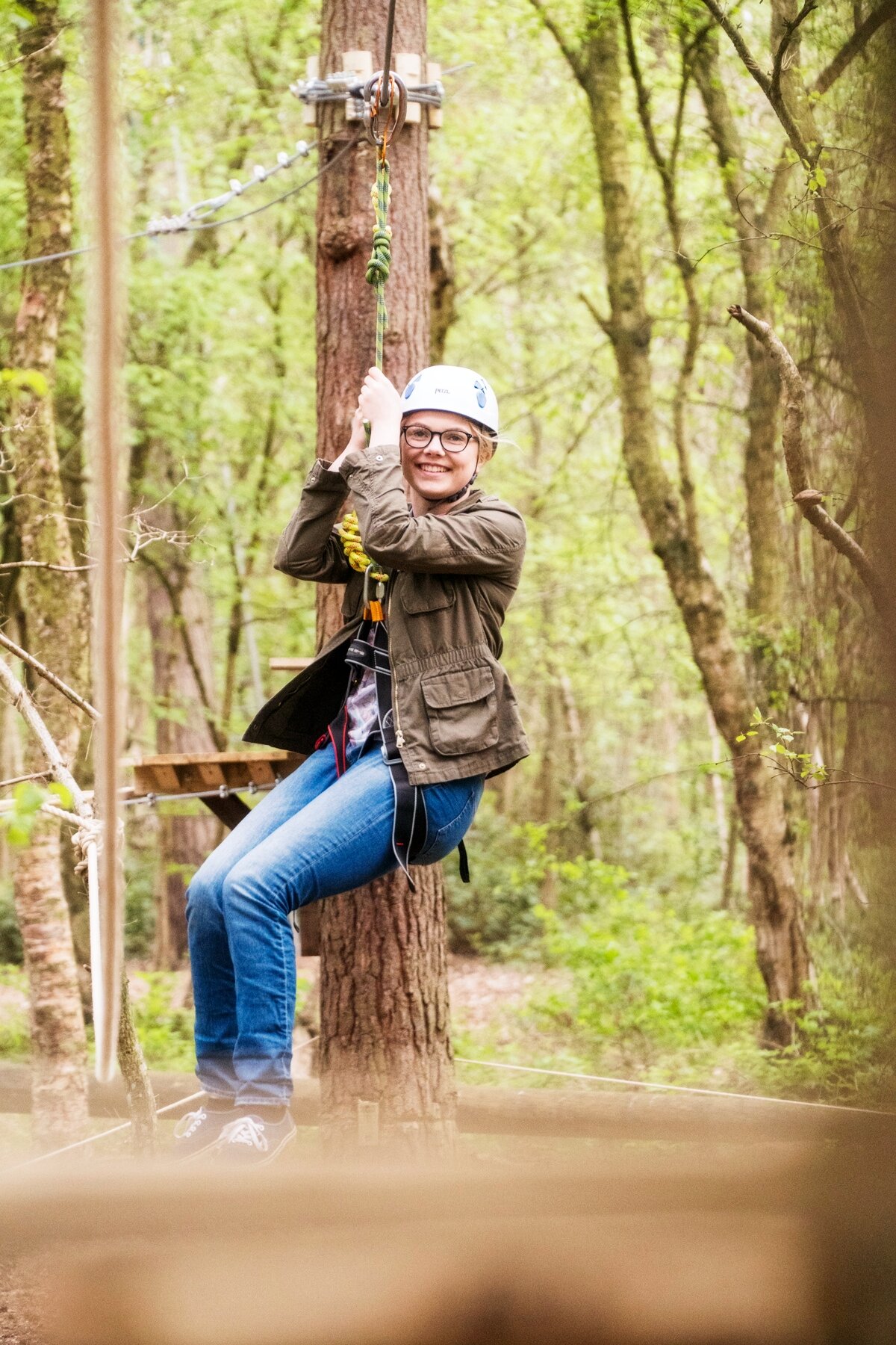 teenage girl on a small zip line