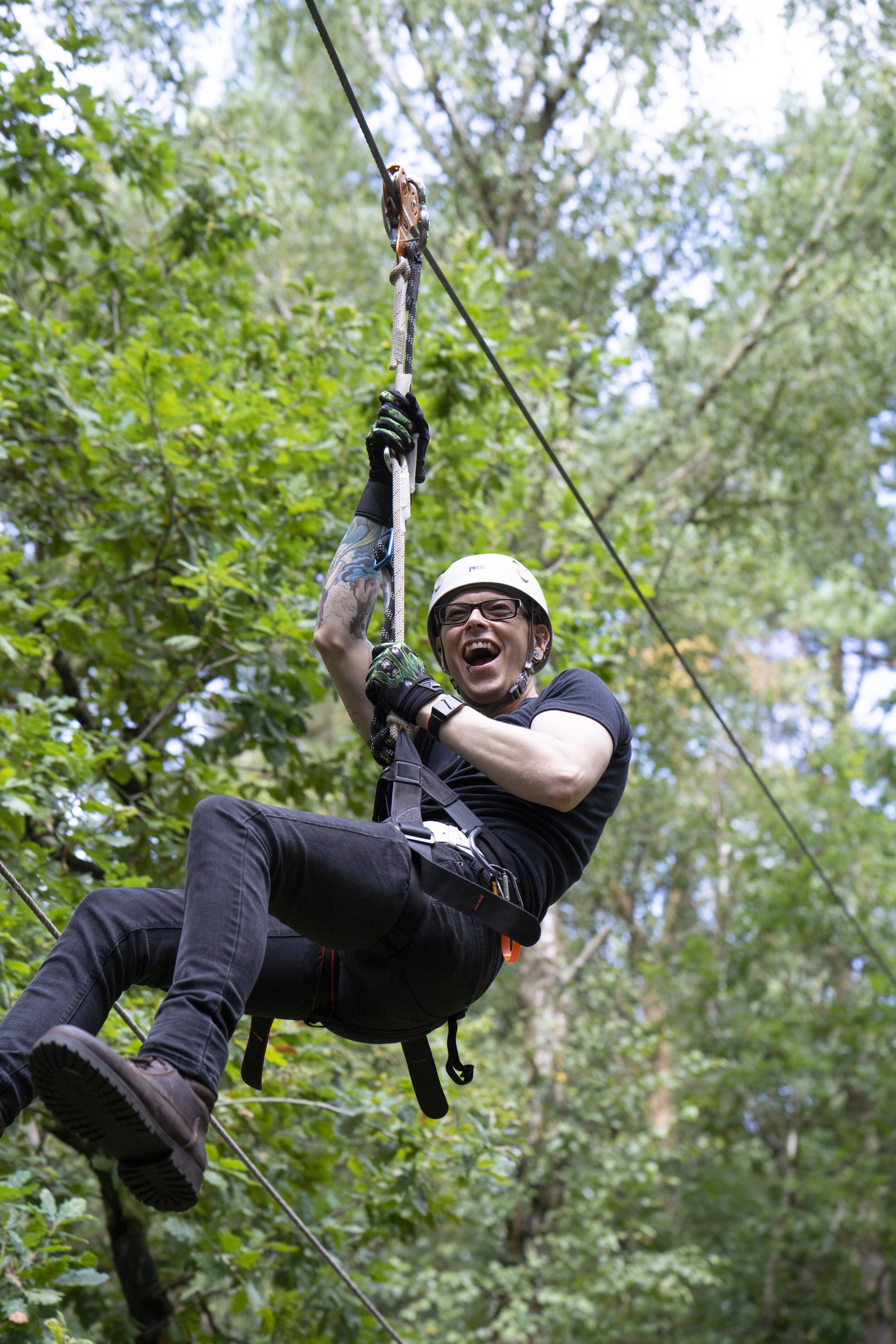 amazing photo of man on zip line