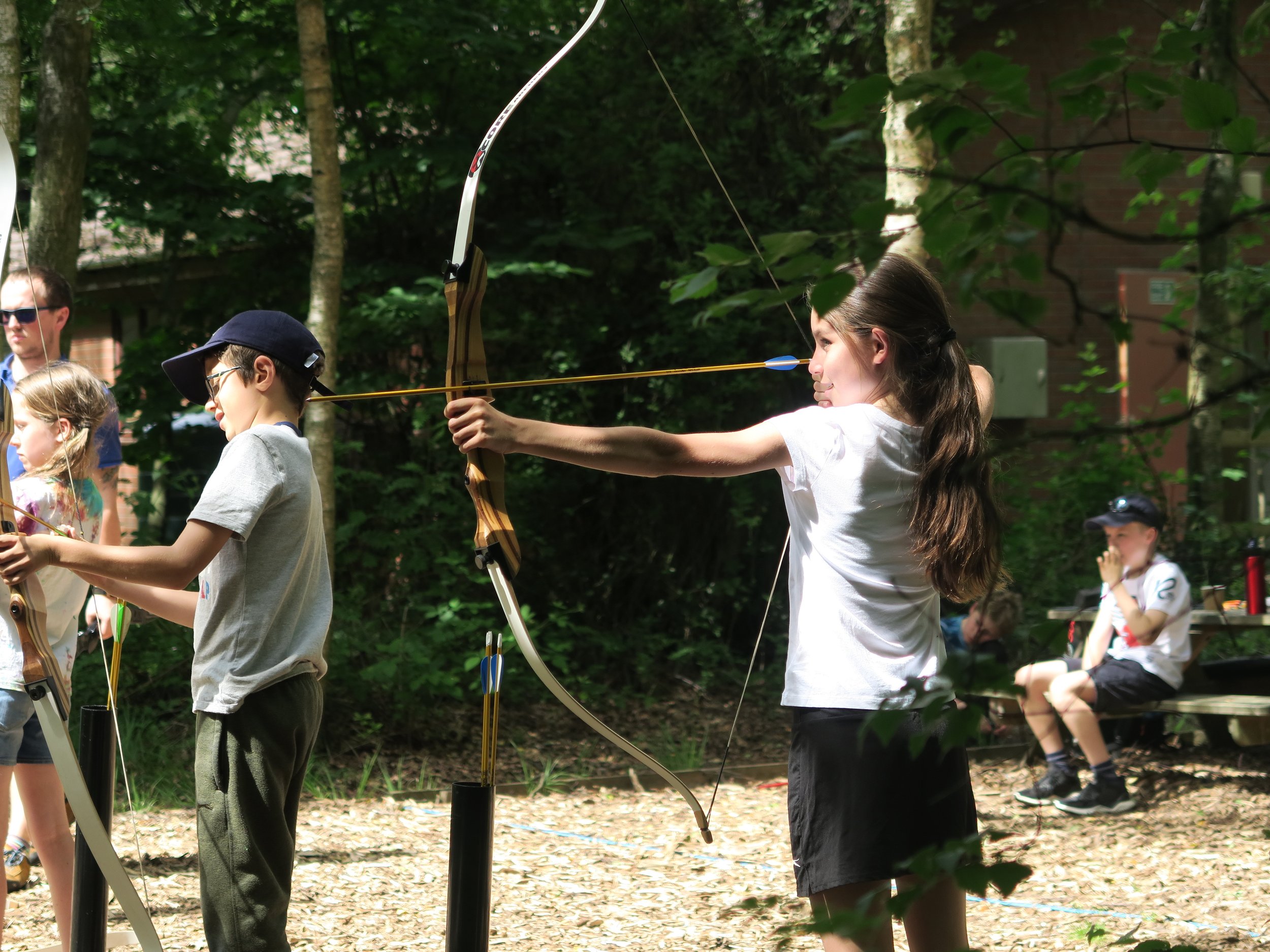 Girl holding a bow and arrow