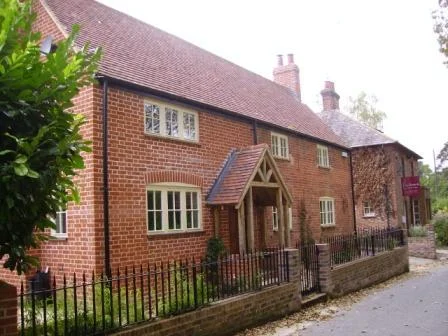 The extensions were demolished, the original cottage refurbished and with materials carefully chosen to match the existing, new accommodation was provided in a two storey extension with a 'cat-slide' roof to the rear.