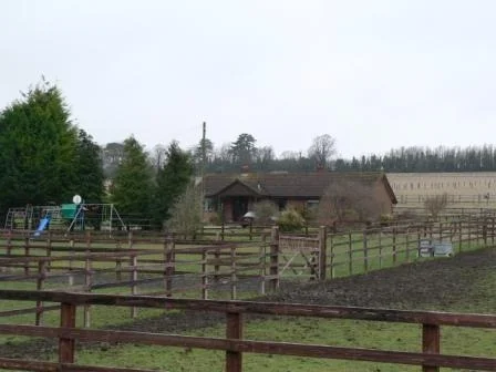 'Tired' racehorse training yard and owner's house before replacement in the Pewsey Vale.
