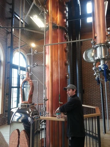 In the Still Room @ Angel's Envy with host Tom Gamble. He's preparing to let us taste "low wine' from the Spirit Safe, the shiny container at left.