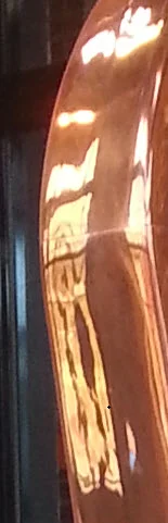 Still Room windows reflected in the shiny copper "bottle" atop the Spirit Safe. @ Angel's Envy Distillery