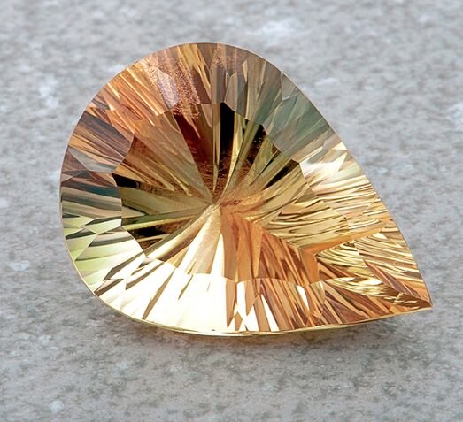 gemstone sitting on a table called Sunstone Photography by Geoffrey watt