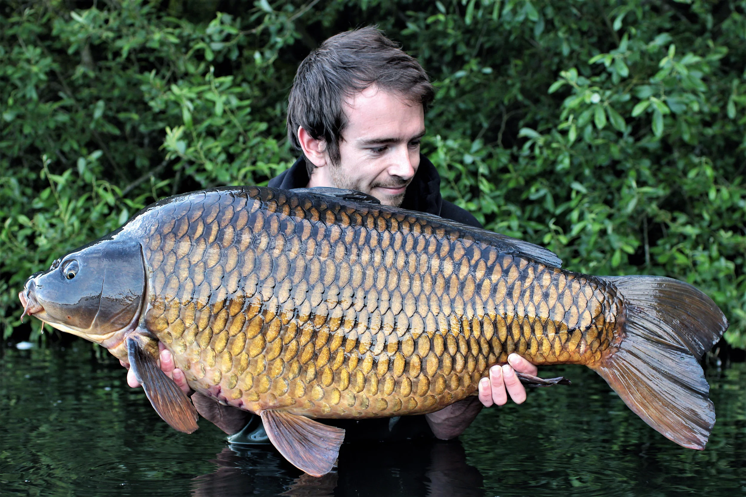 PIC 15- A breeze-block of a common, which turned out to be one of the biggest of the 16-fish he caught.jpg