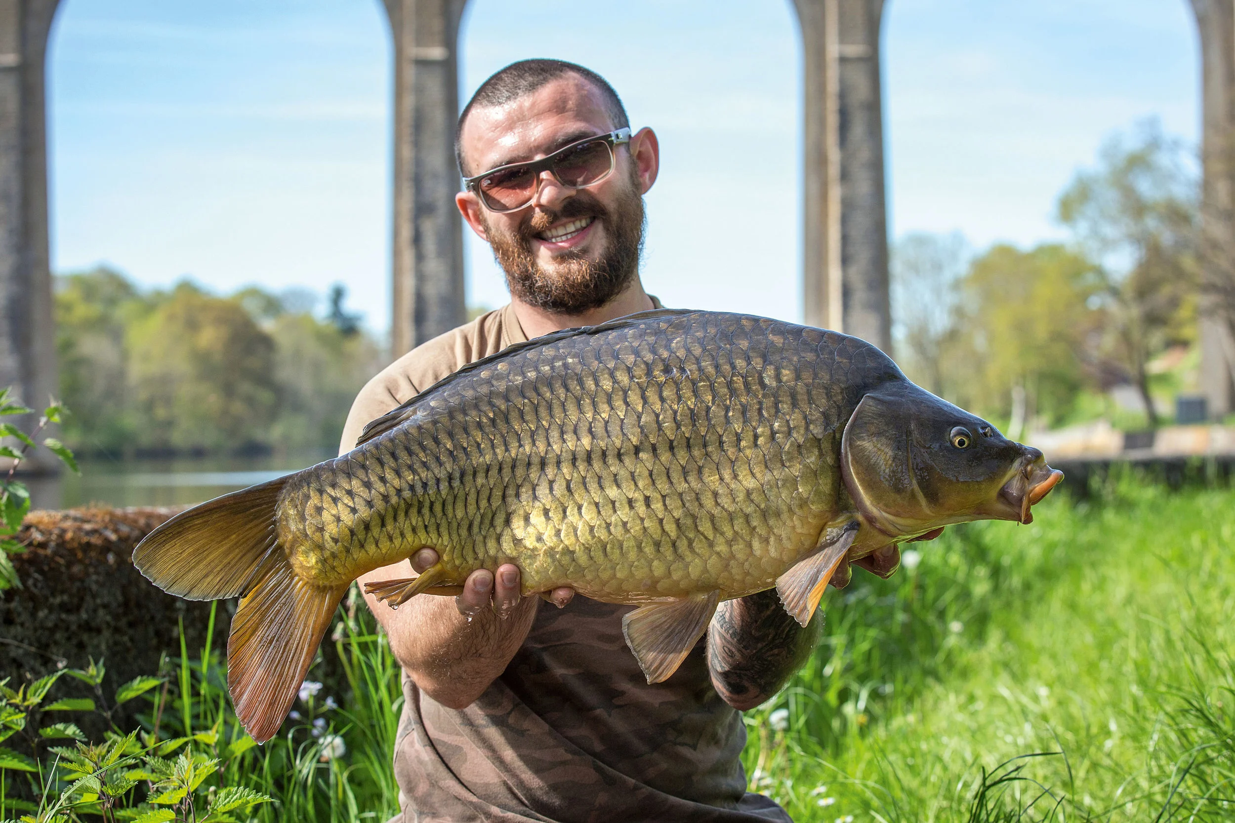 Sean with the first carp from the river, at a little over 21lb