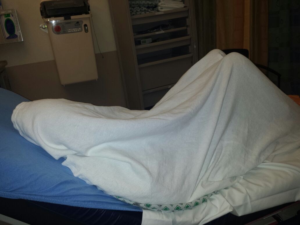 the lights felt so bright in the ER, i covered my face with the blanket to get what rest i could.