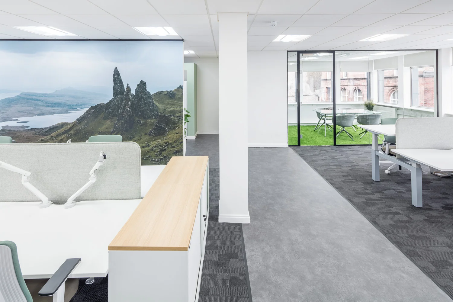 Double monitor arms mounted on-sit stand desks at the new offices of CitNOW in Stirling