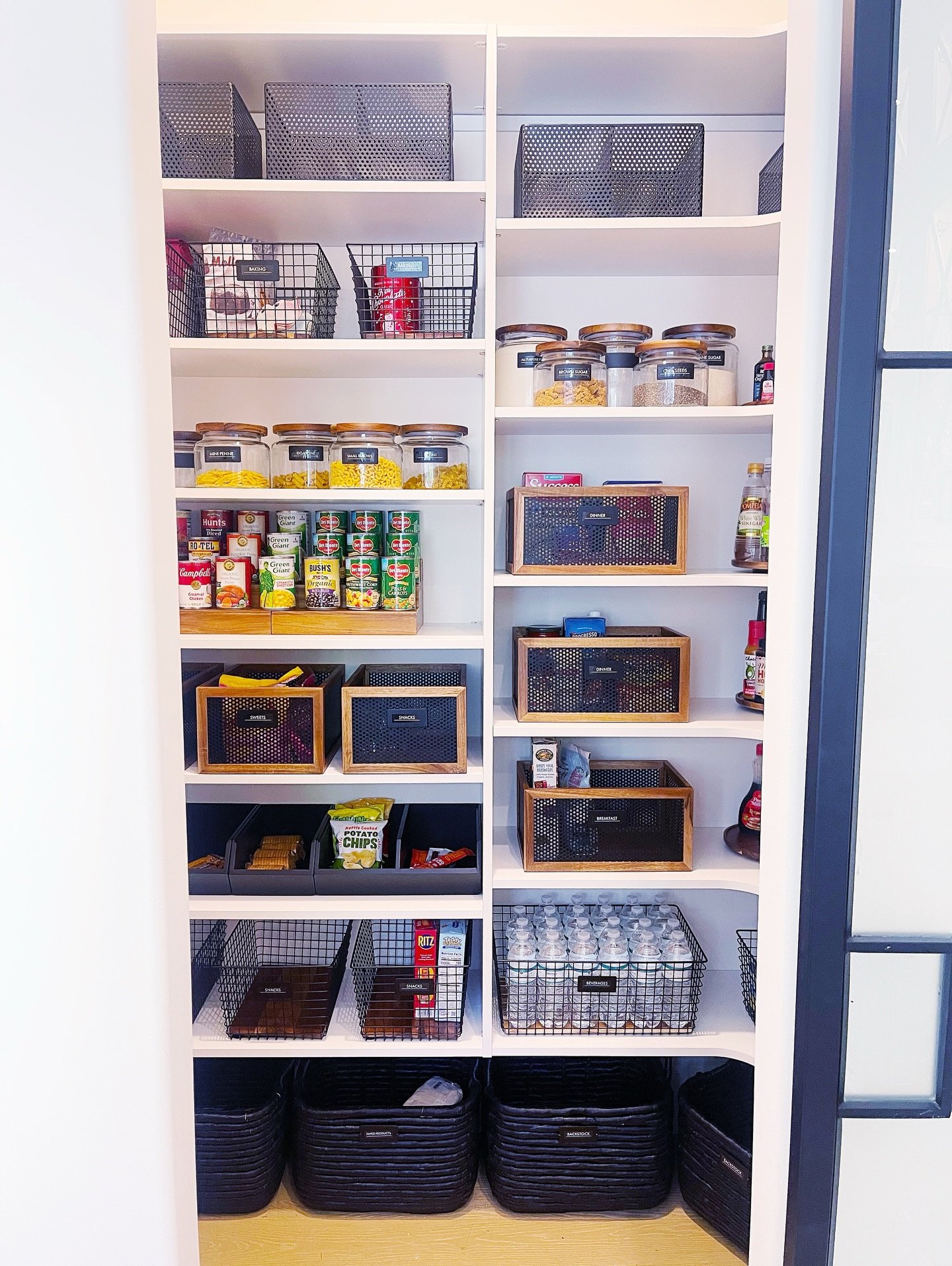 PAINT IT BLACK⁣
⁣
We will forever love a black and neutral wood pantry. 🖤🤍⁣
⁣
⁣
⁣
⁣
⁣
Luxury home organizing in Atlanta designed to transform your home into a calm, elevated and intentional space. #organizer #atlanta #homeorganizing