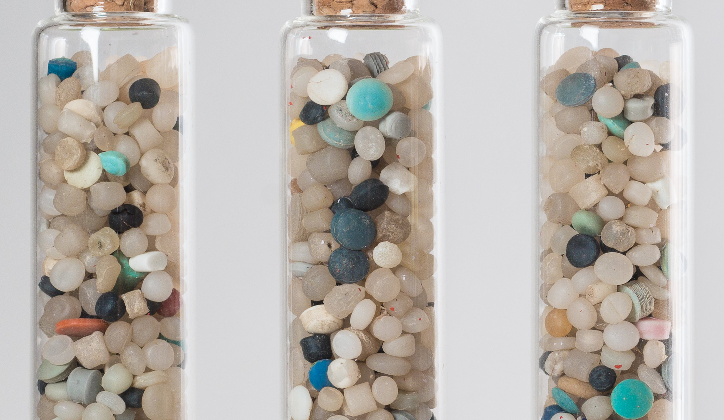 Close-up of nurdles from Sodus Beach, NY. 2016. They are how every plastic product begins it's life. Pre-production plastic beads. Their technical name? Nurdles. They are produced in the trillions every year, and shipped all over the world in shipp