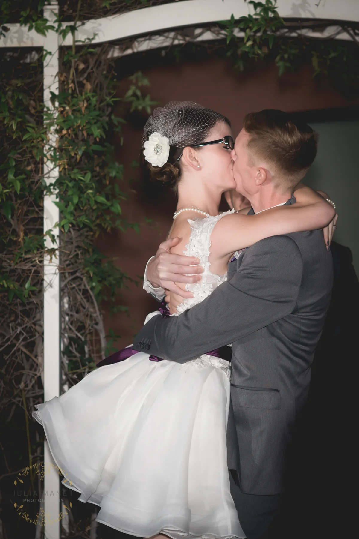 "You may kiss the bride!" the officiant said. So, they kissed. Then kissed again. He lifts her up off her feet in exuberance. Someone in the crowd jokingly shouts, "Oh come on, guys. Cut it out!" And the bride, bless her heart, snaps, "No!" and kisses him again.