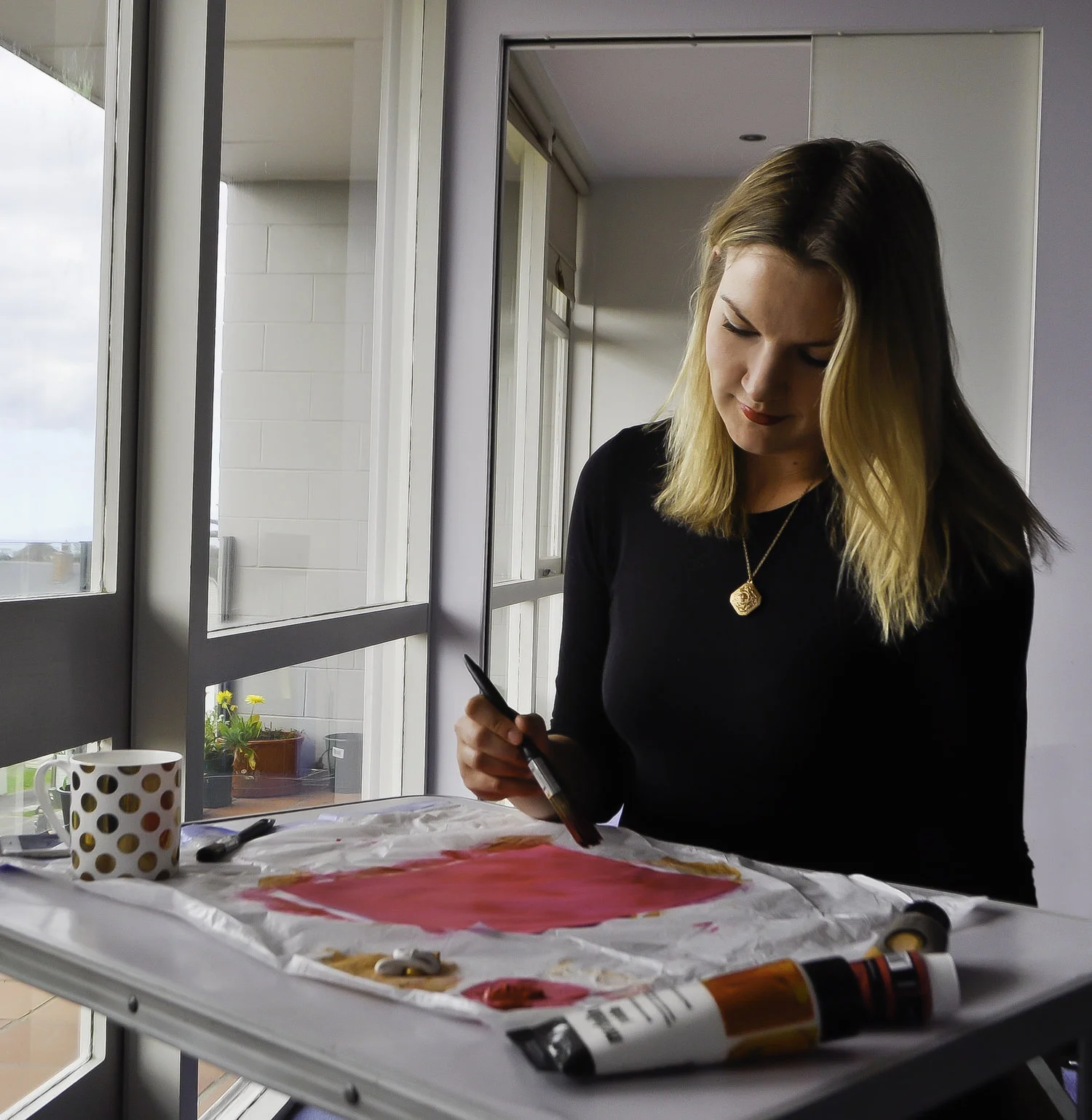 That's me, busy working on a client's print design. Wherever I am, you'll be sure to find a cup of tea with me!