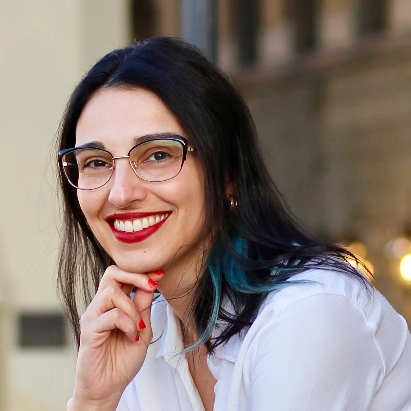 Headshot of Jade resting her chin on her hand