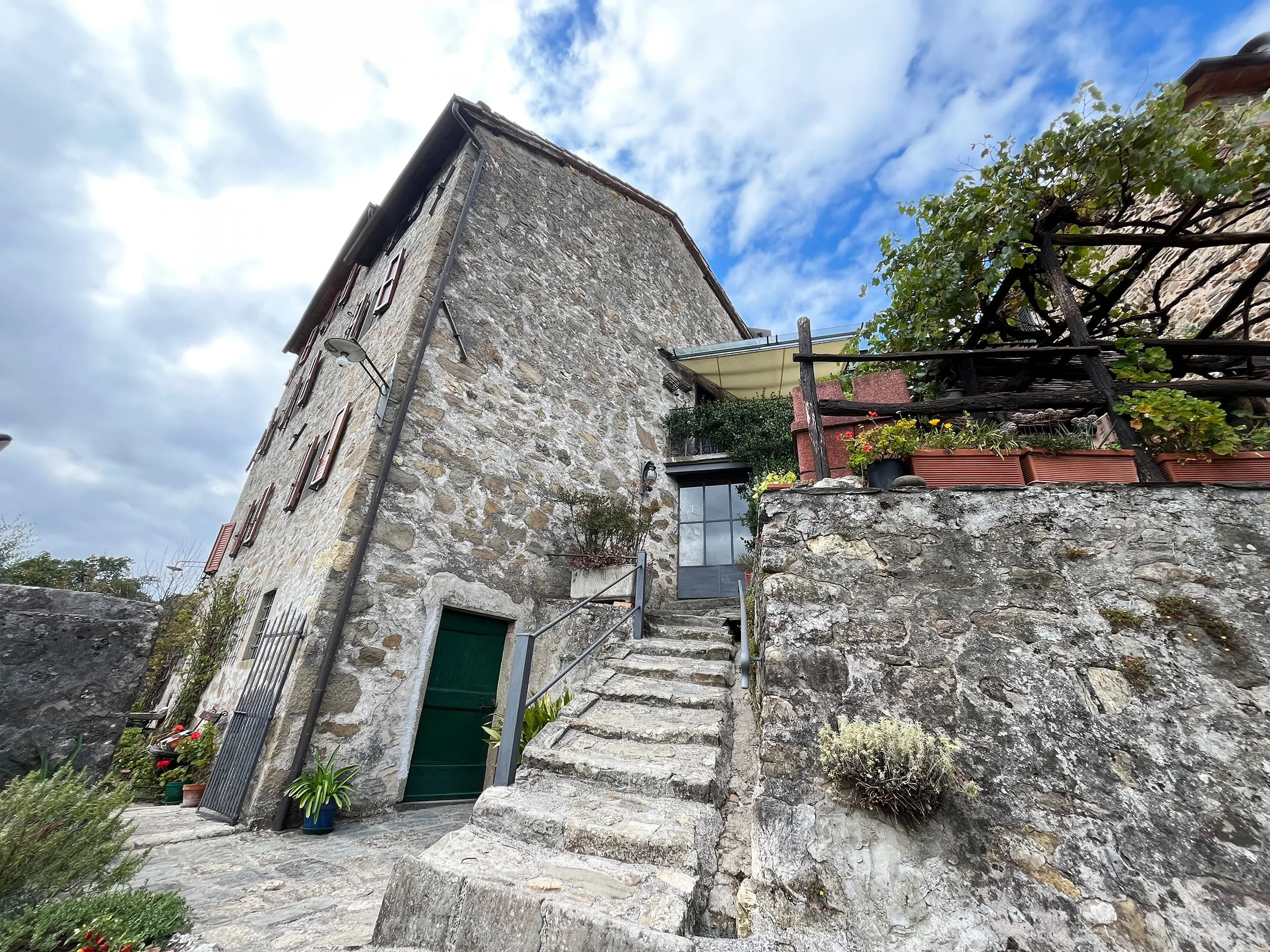 Looking up at typical stone Tuscan house
