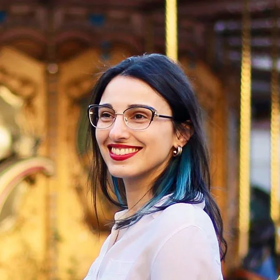Headshot of Jade in front of carousel