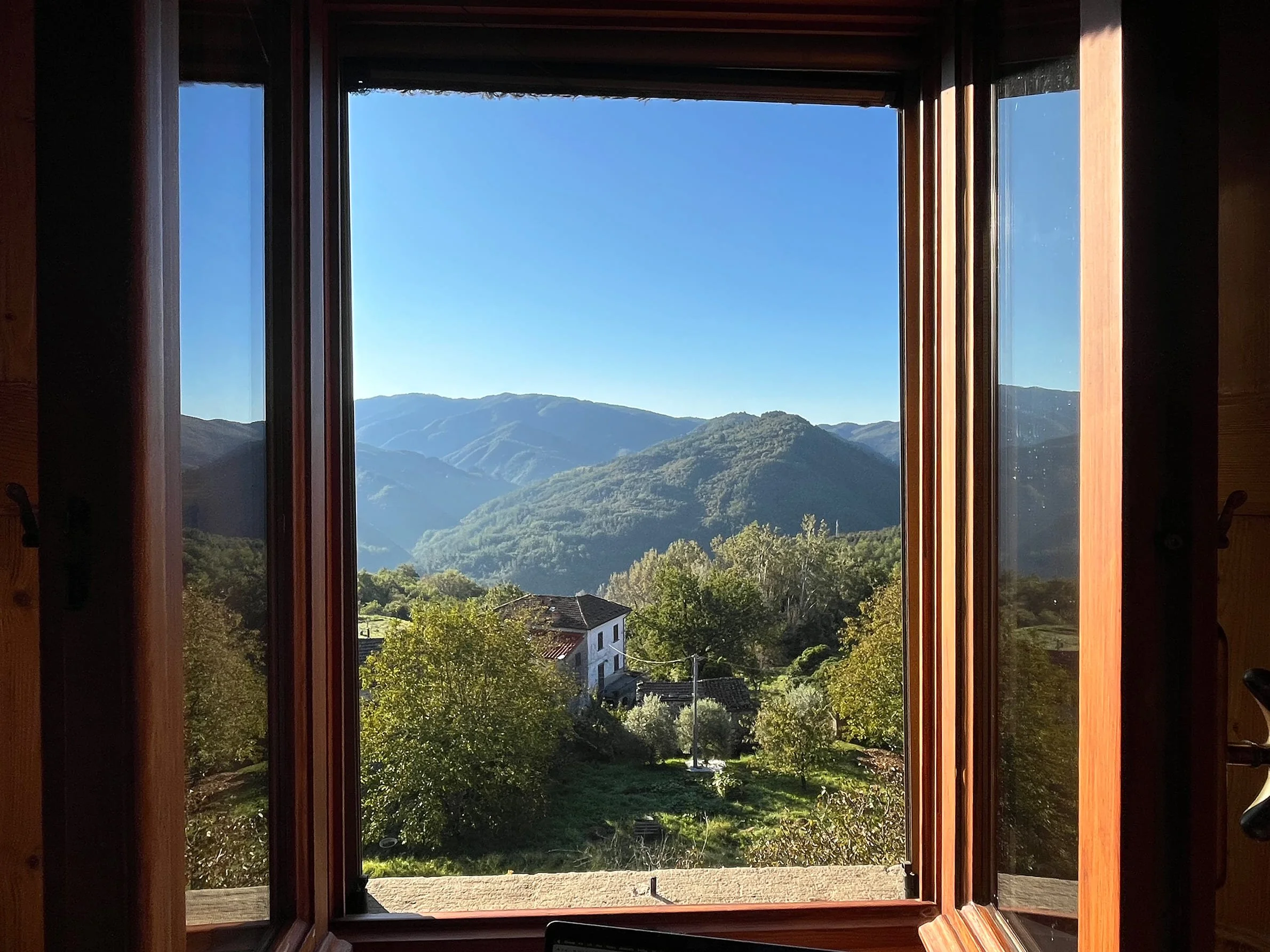 View from window of green hills
