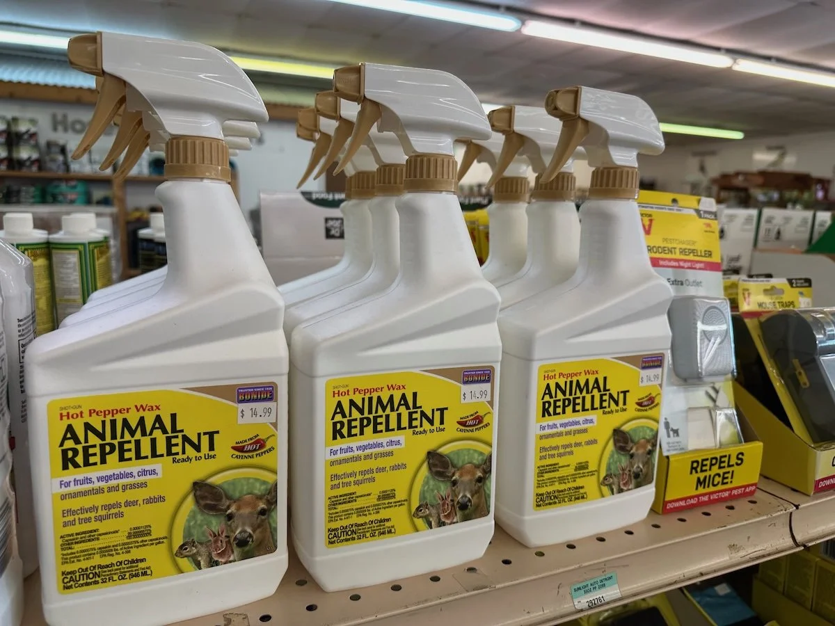Bottles of Animal Repellent on a shelf in Indianapolis garden center