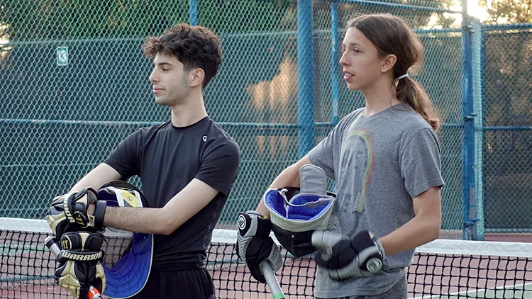 Two traditional saber fencers.