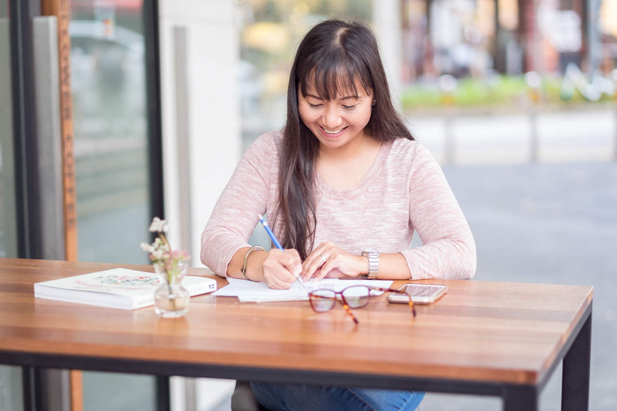 Our team's lettering artist, Mye De Leon - currently based in Singapore. Photo by: Johann Carlo Molo Photography