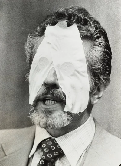 Dr. R. L. Noran, an ESP practitioner, with half-dollar coins taped over his eyes to prohibit the use of his visual sense during an ESP demonstration, ca. 1978. Courtesy of the artist's archive.