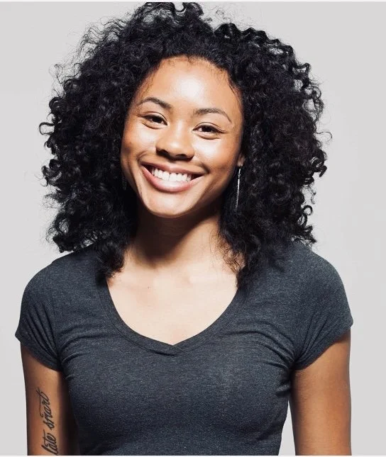 Alana smiling at the camera