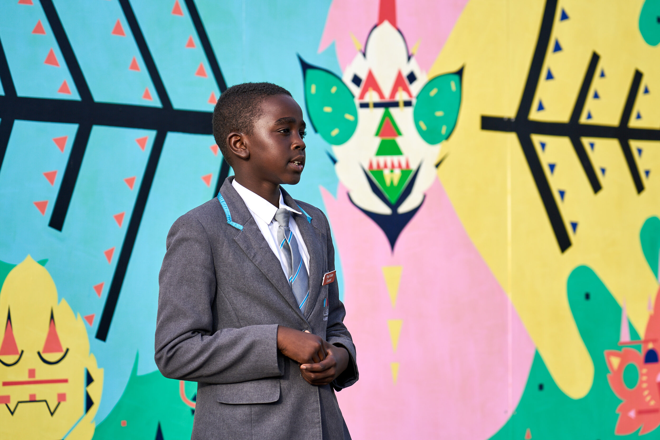  One of the pupils from Edna G Olds Academy, speaking at the project launch event, standing in front of the first mural 