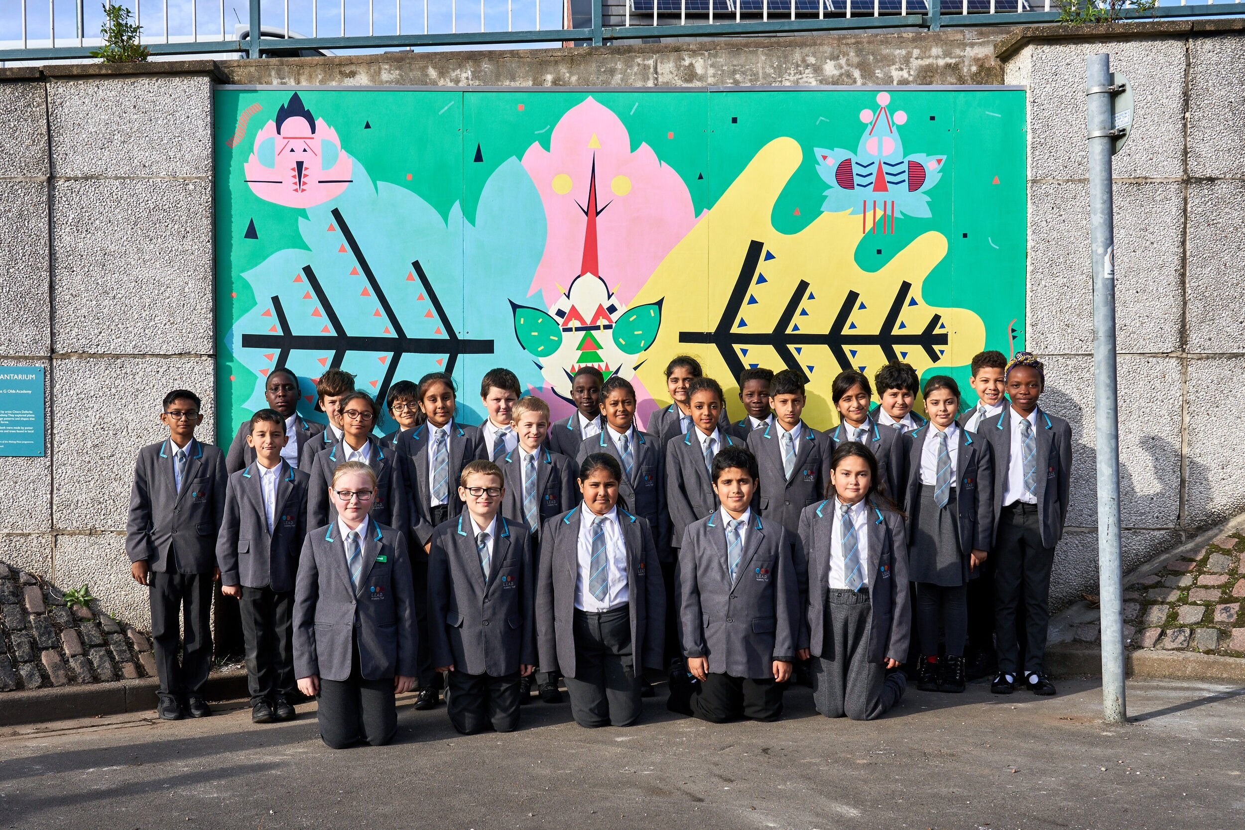  The children from Edna G Olds Academy in front of the first mural 